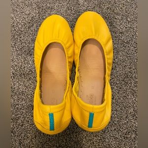 Gently used pair of mustard yellow tieks size 10